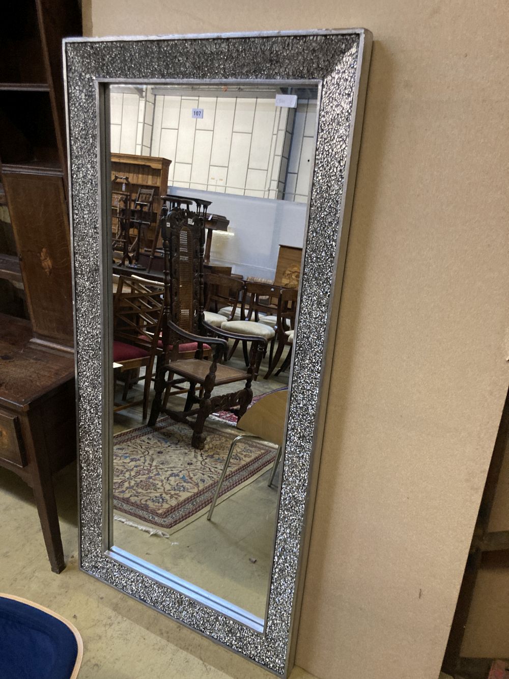 A modern silvered framed wall mirror, width 83cm height 170cm